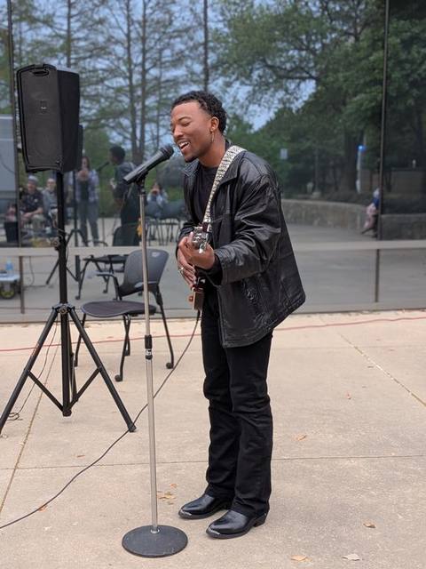Stepping up to sing.